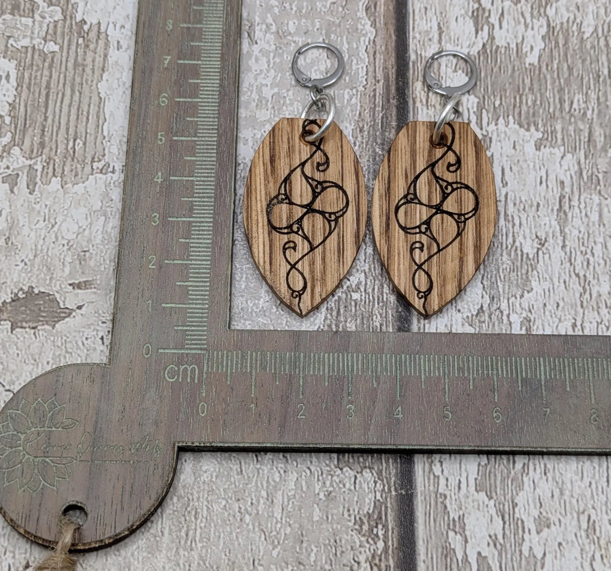 Oak wood British museum Celtic pattern book design earrings with stainless steel findings.