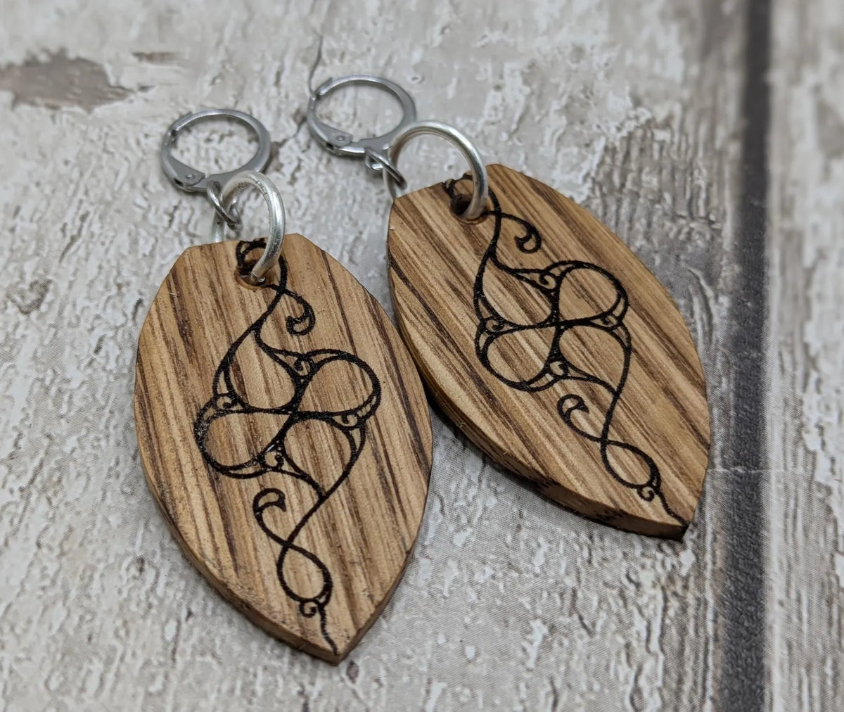 Oak wood British museum Celtic pattern book design earrings with stainless steel findings.