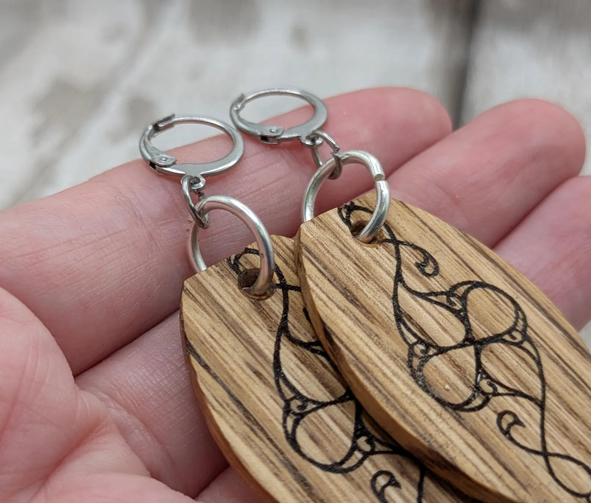 Oak wood British museum Celtic pattern book design earrings with stainless steel findings.