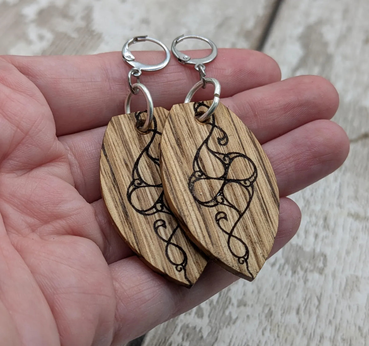 Oak wood British museum Celtic pattern book design earrings with stainless steel findings.