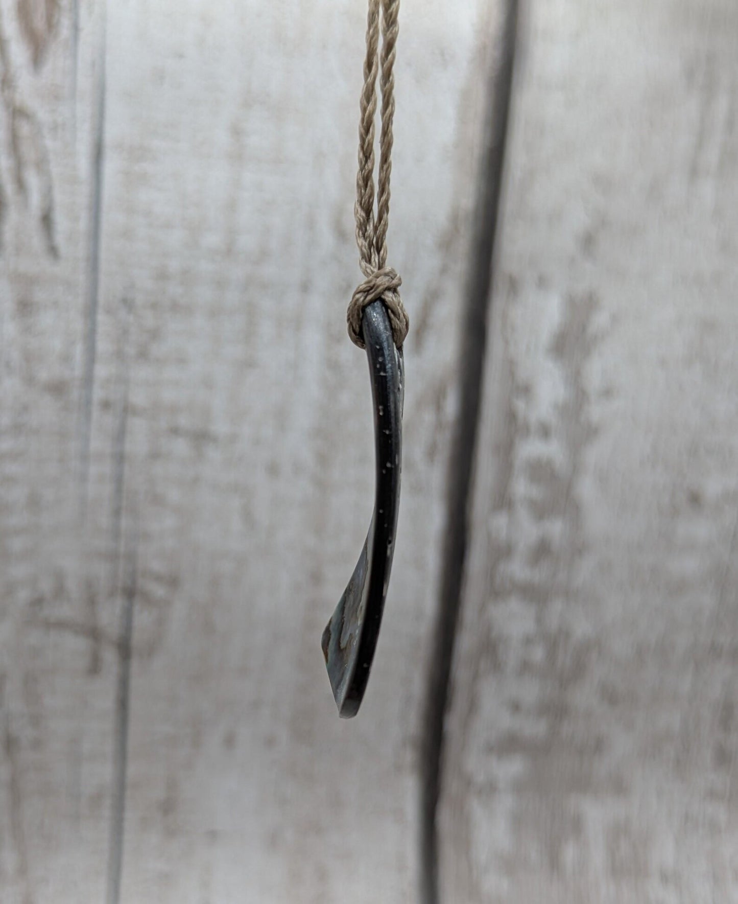 Small New Zealand Pāua Shell Triangle Pendant – Iridescent Abalone Necklace on Adjustable Waxed Cord, ocean themed, natural pattern.