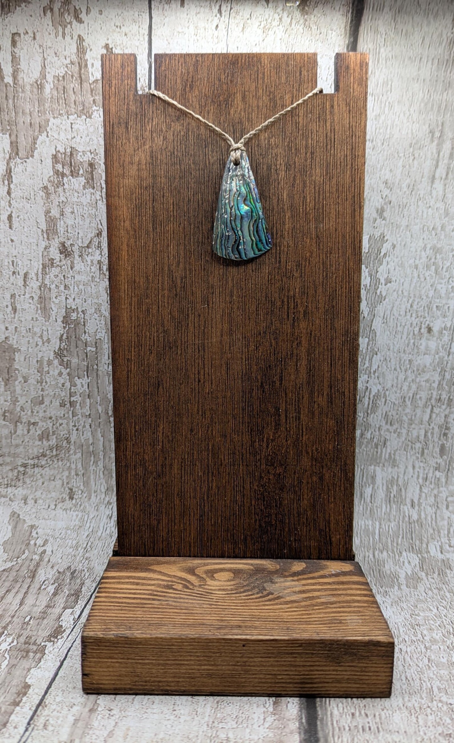 Small New Zealand Pāua Shell Triangle Pendant – Iridescent Abalone Necklace on Adjustable Waxed Cord, ocean themed, natural pattern.