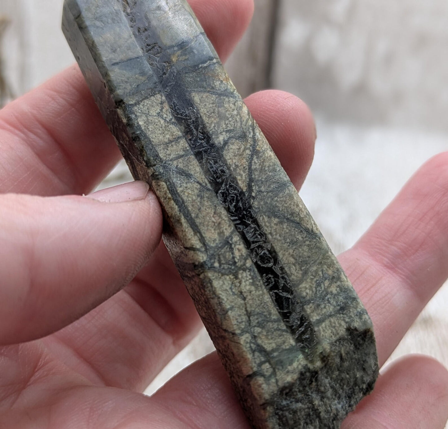 Impactite pendant with mixed tektites and meteorite specimen.