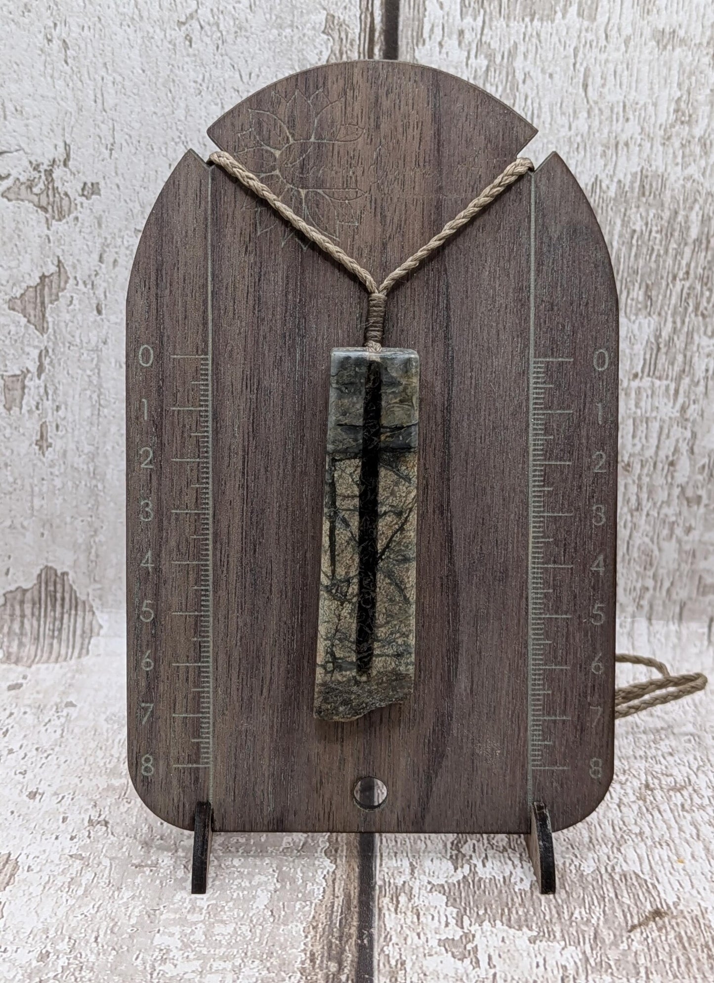 Impactite pendant with mixed tektites and meteorite specimen.