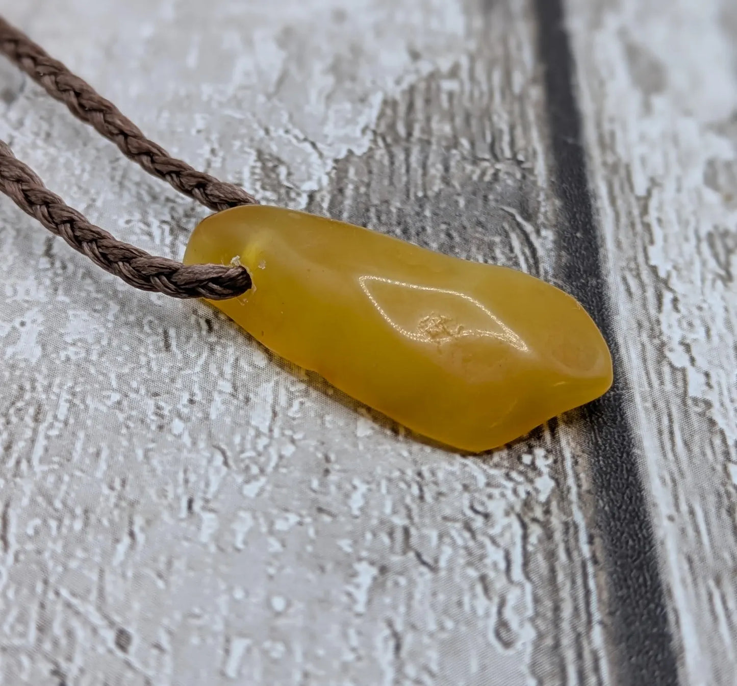 Tumble polished baltic Amber pendant.