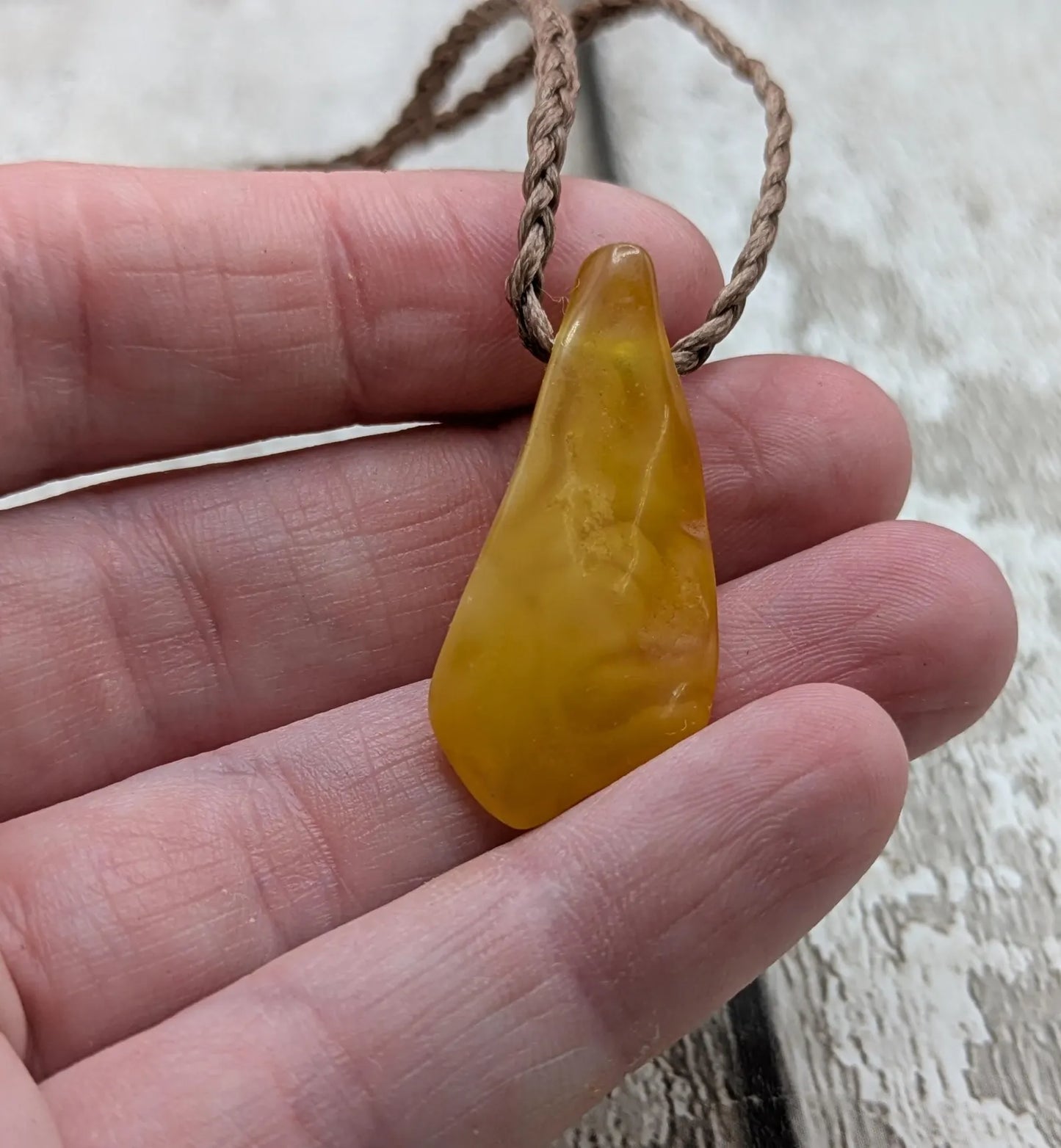 Tumble polished baltic Amber pendant.