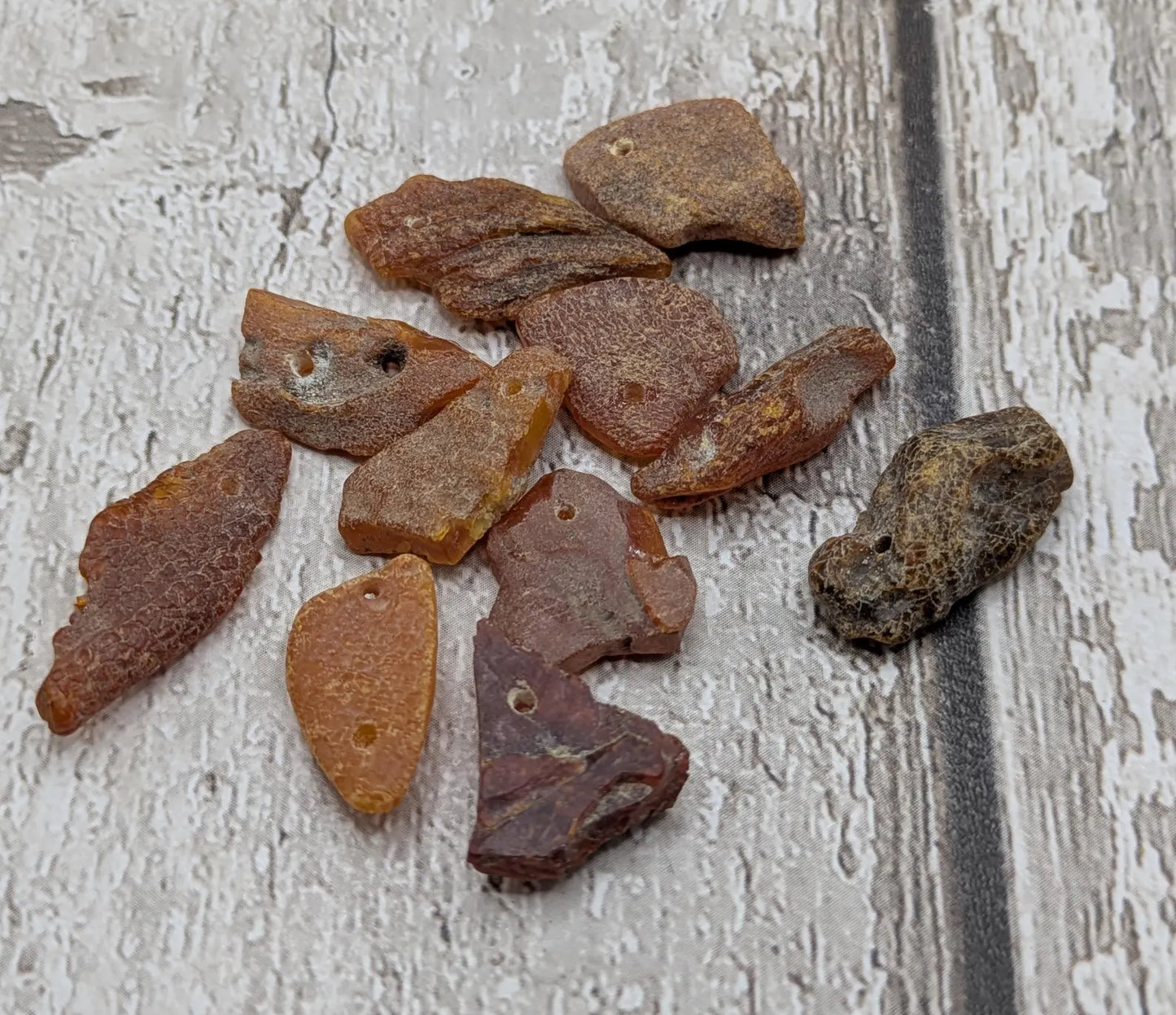 Raw natural top drilled Baltic Amber beads.