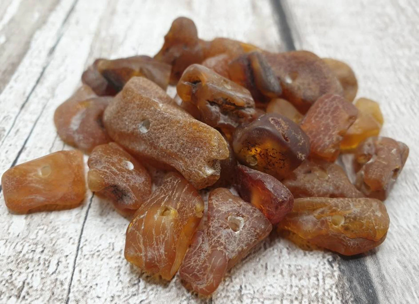 10 Raw natural centre drilled Baltic Amber beads.
