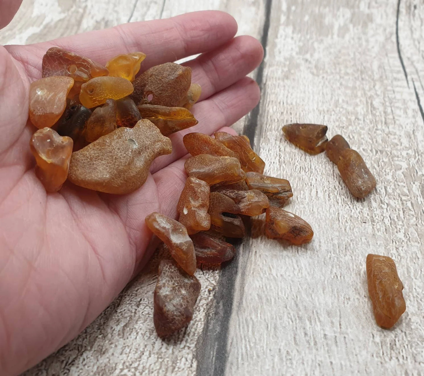 10 Raw natural centre drilled Baltic Amber beads.