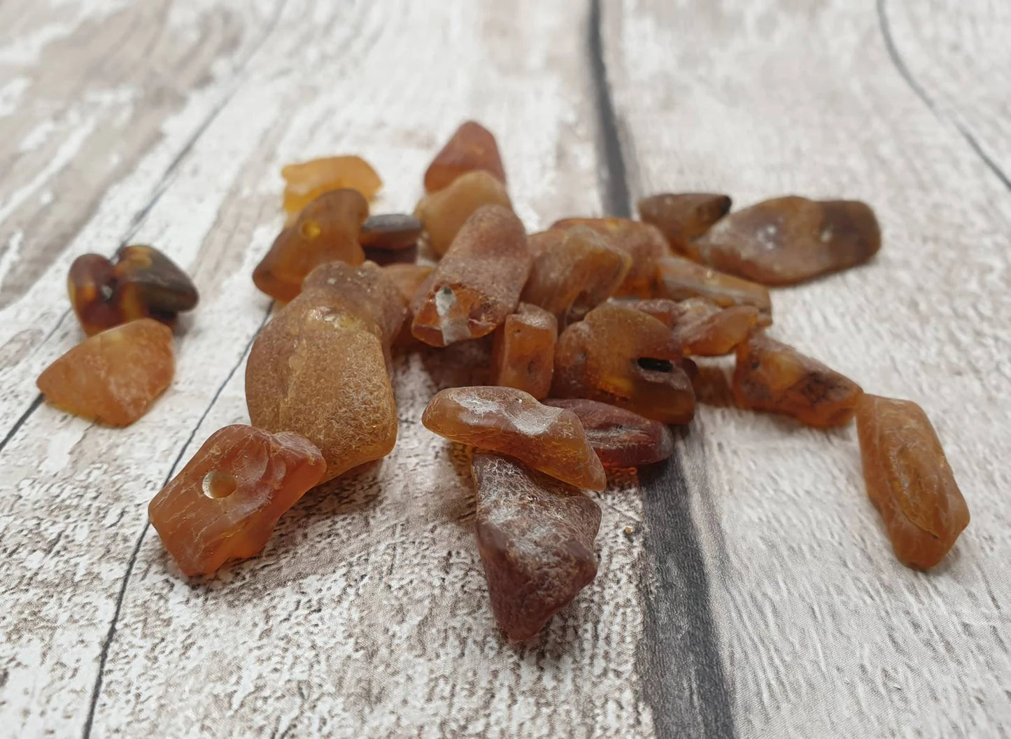 10 Raw natural centre drilled Baltic Amber beads.