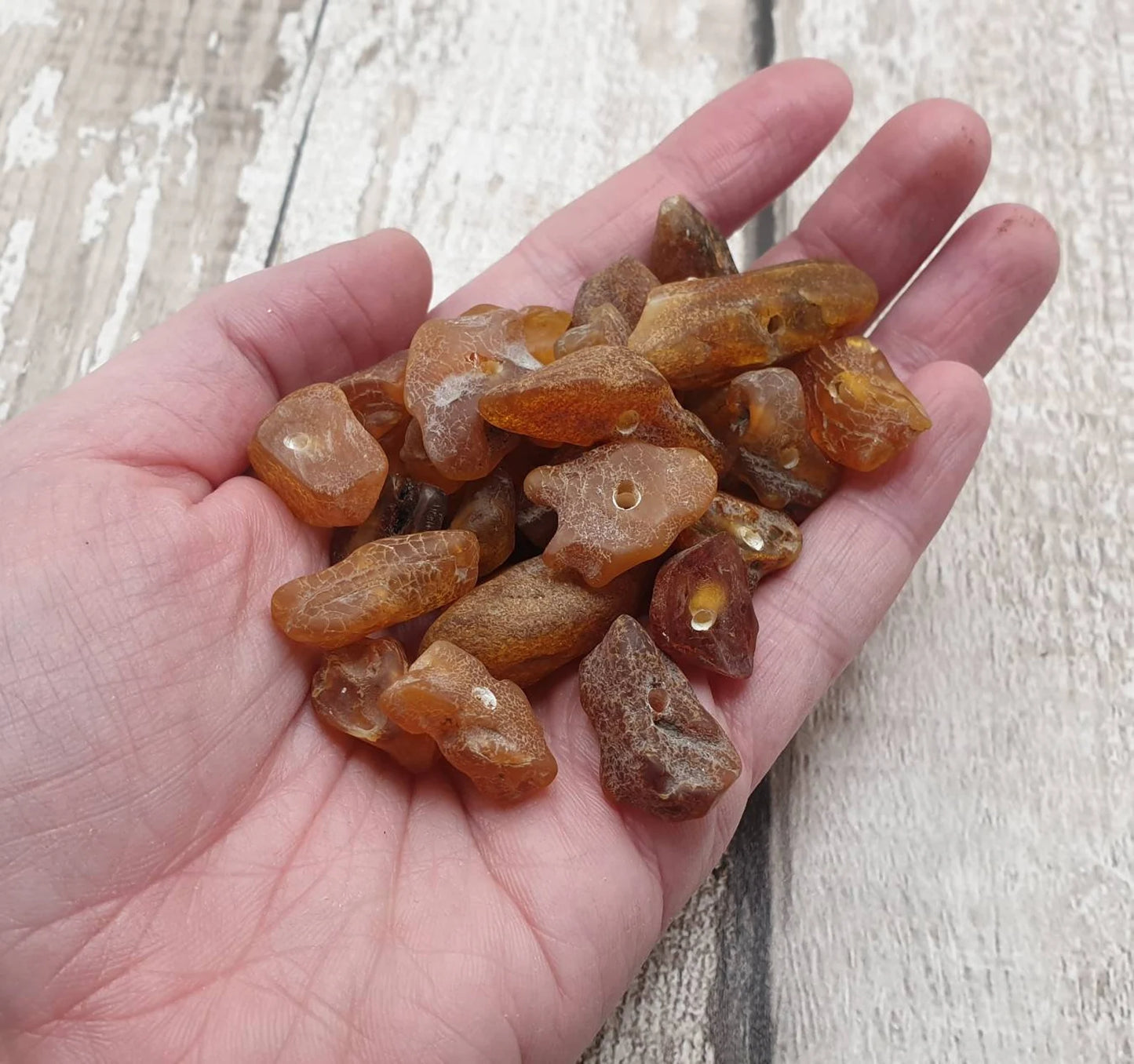 10 Raw natural centre drilled Baltic Amber beads.