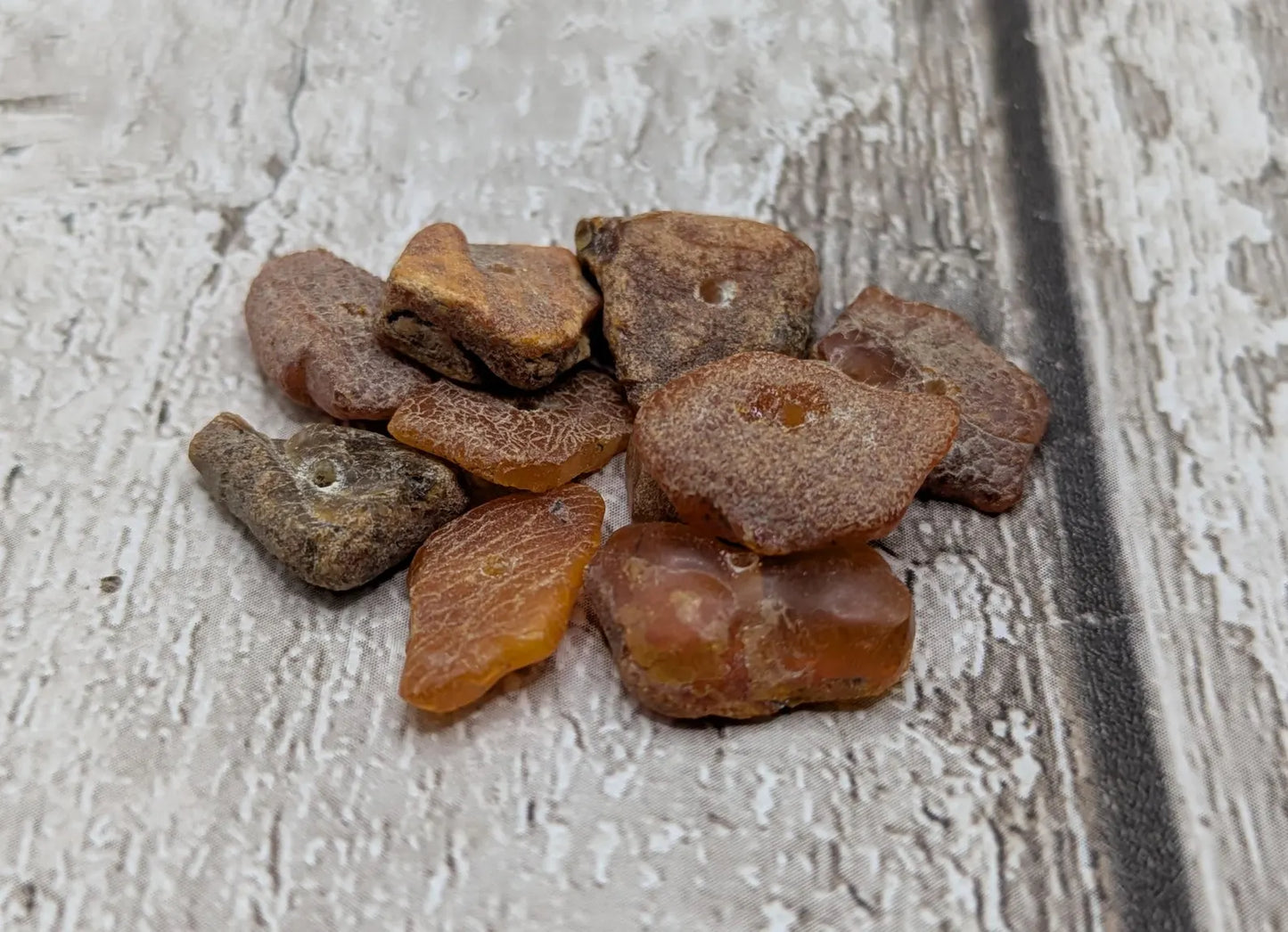 10 Raw natural centre drilled Baltic Amber beads.