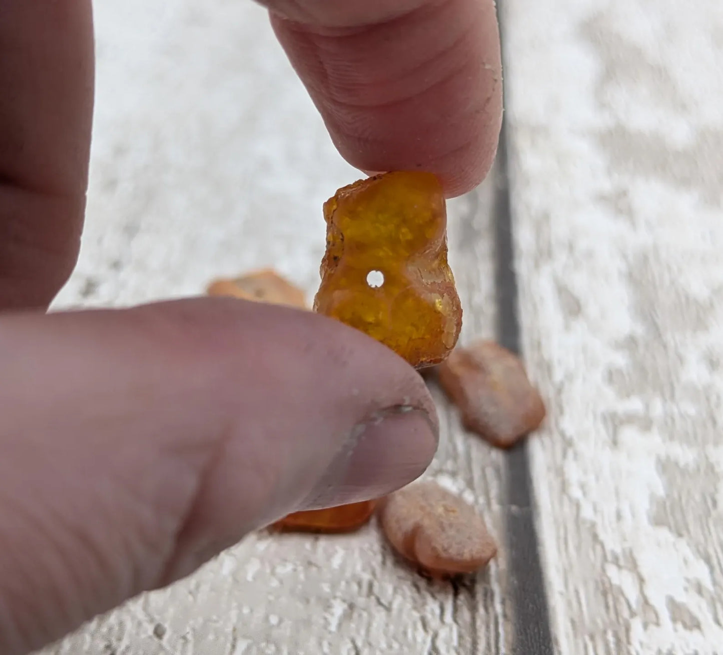 10 Raw natural centre drilled Baltic Amber beads.