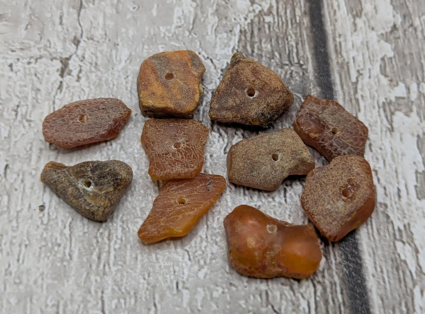 10 Raw natural centre drilled Baltic Amber beads.