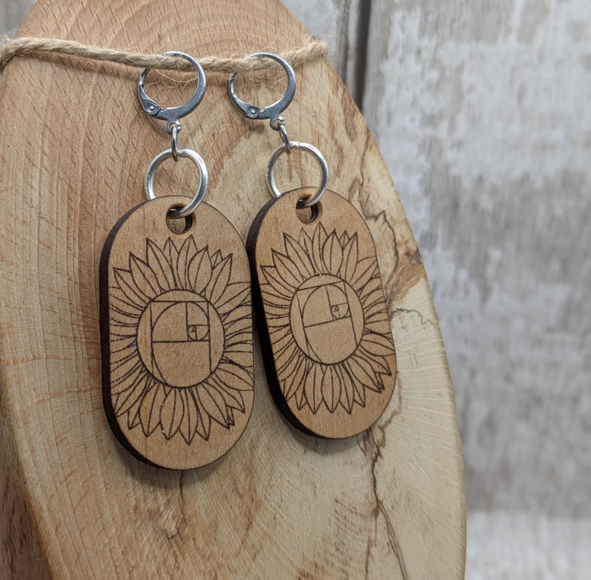 Lime wood sunflower Fibonacci hoop earrings.