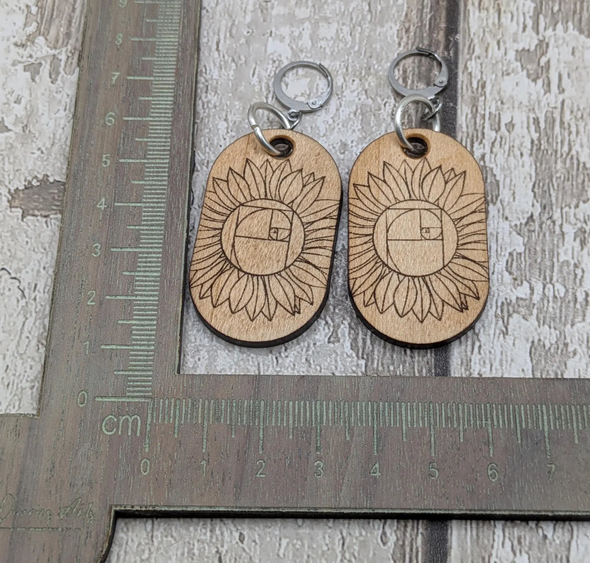 Lime wood sunflower Fibonacci hoop earrings.