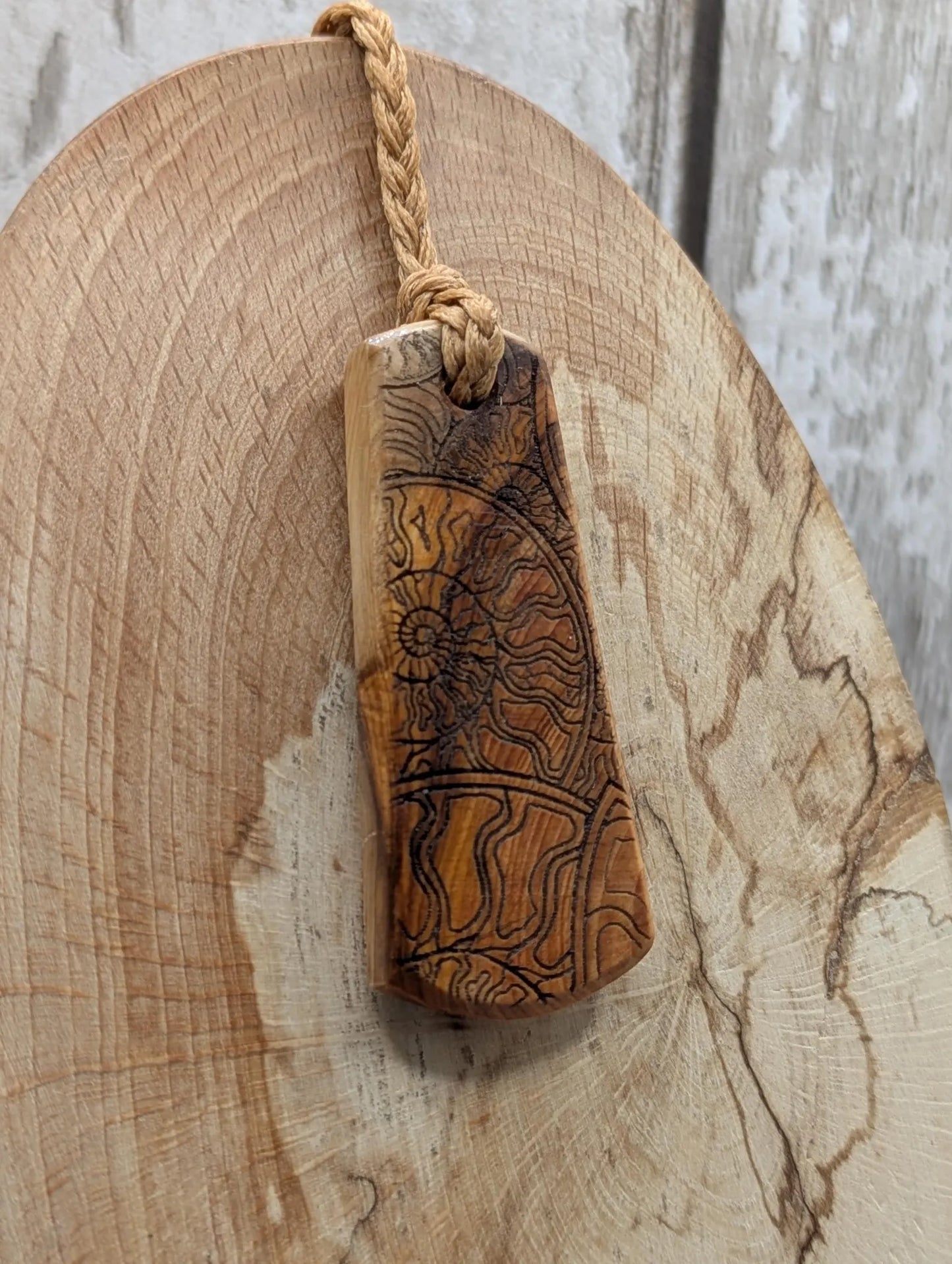 Yew wood laser printed all over ammonite print pendant.