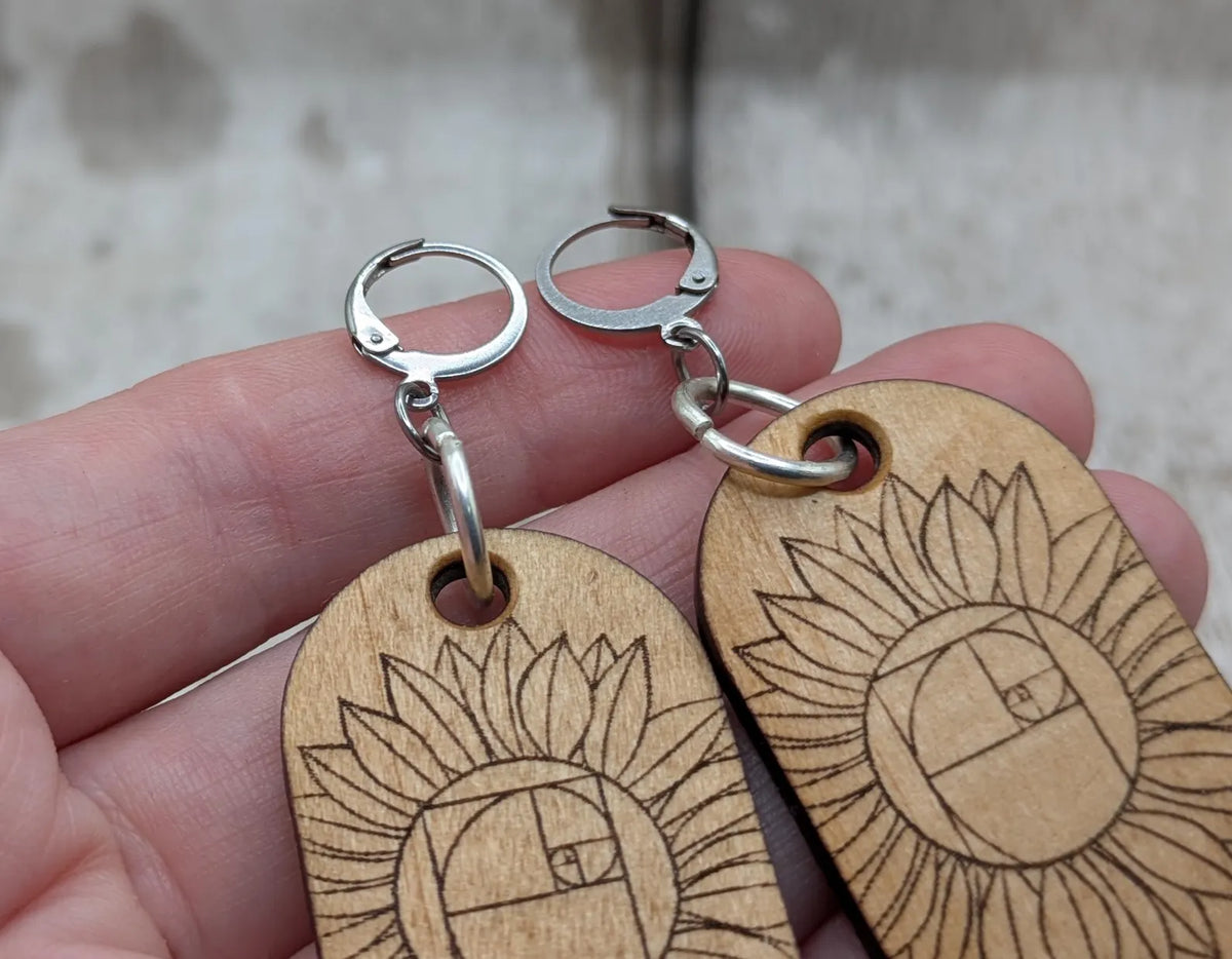 Lime wood sunflower Fibonacci hoop earrings.