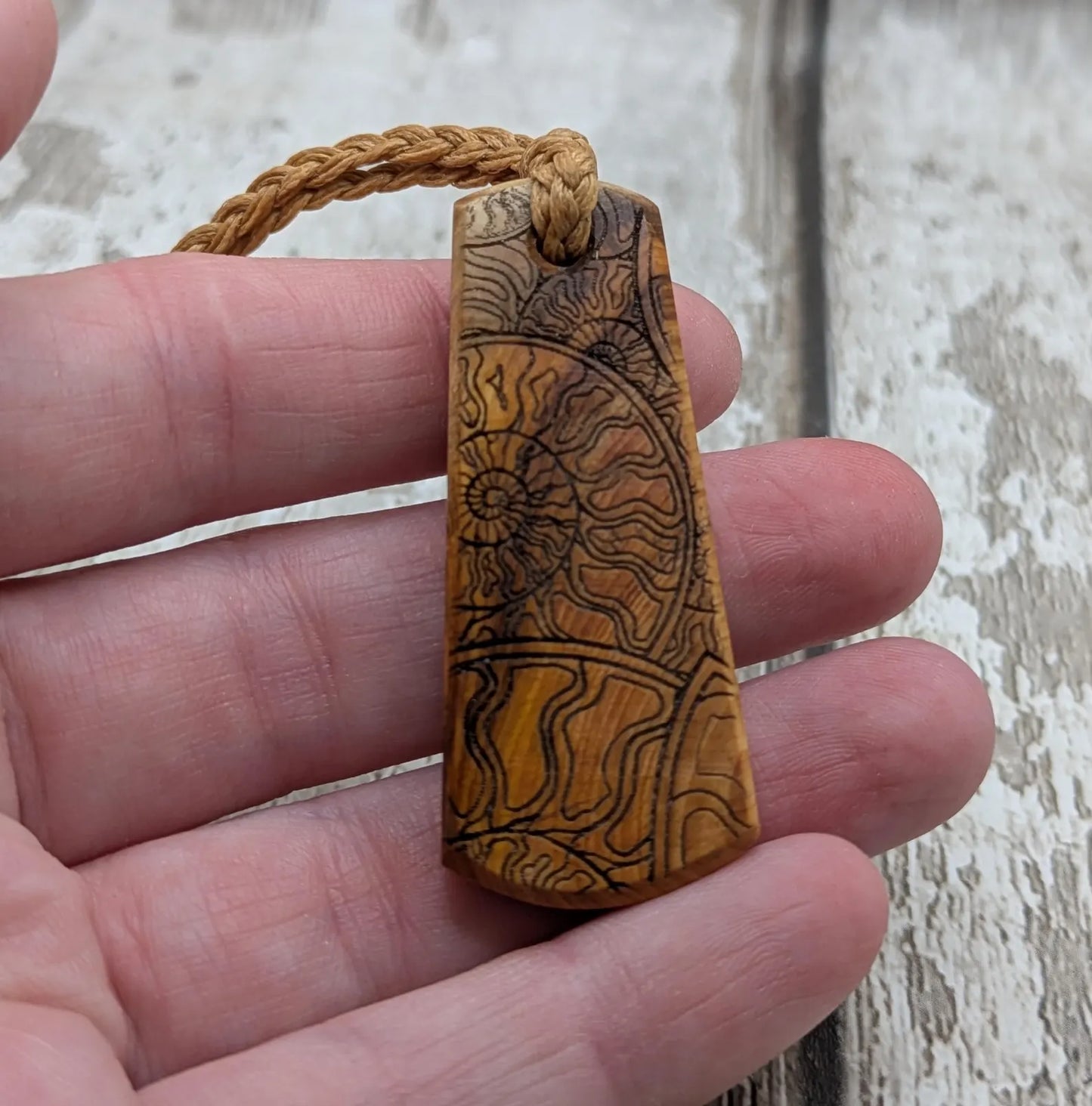 Yew wood laser printed all over ammonite print pendant.