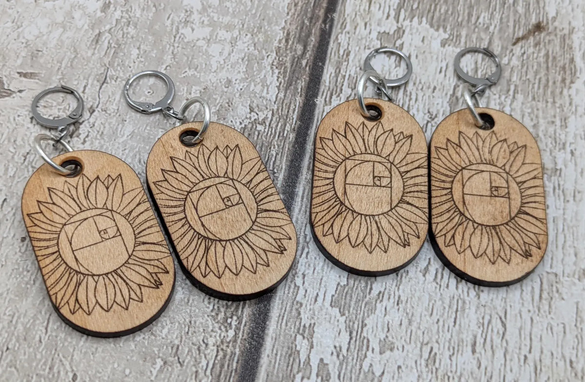 Lime wood sunflower Fibonacci hoop earrings.