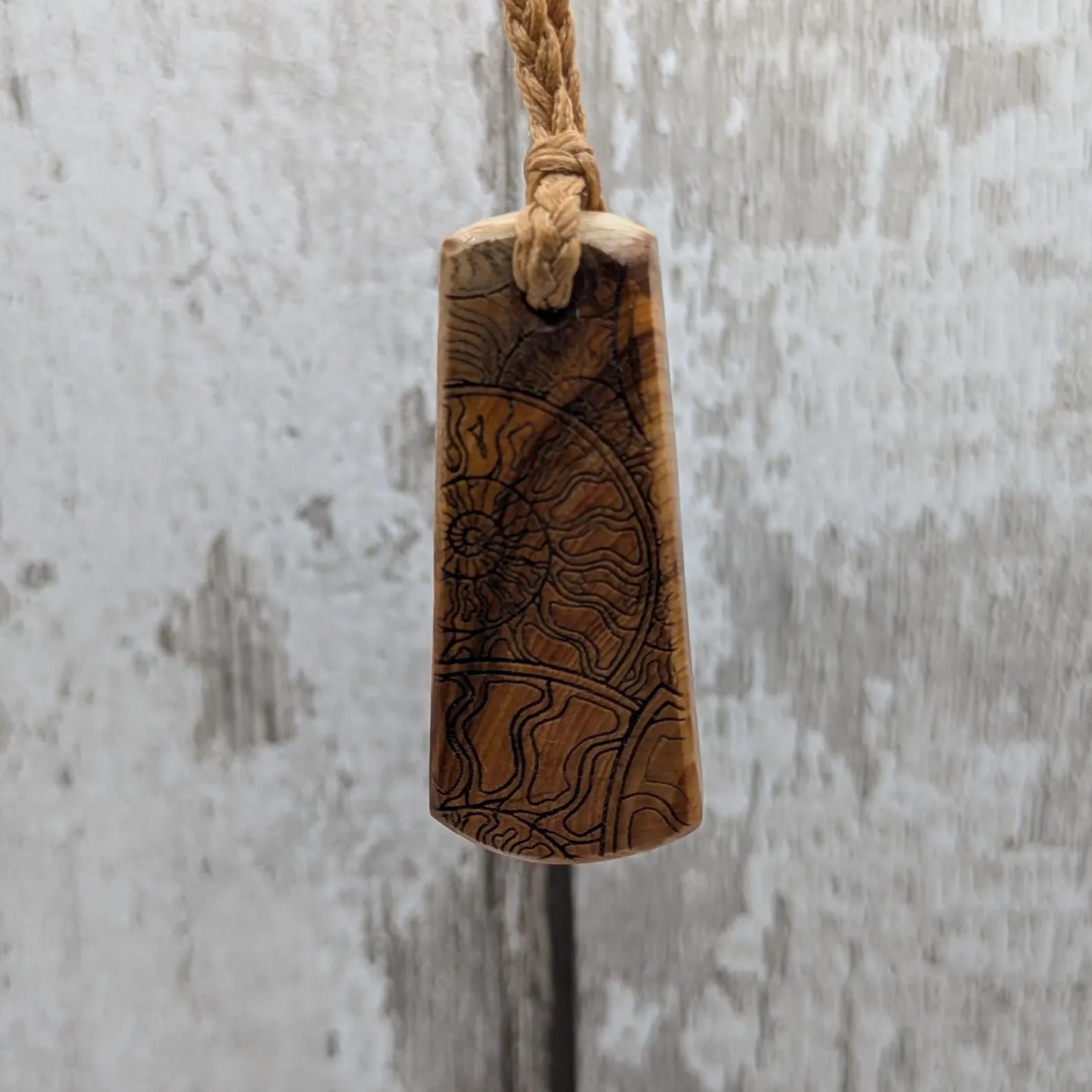 Yew wood laser printed all over ammonite print pendant.