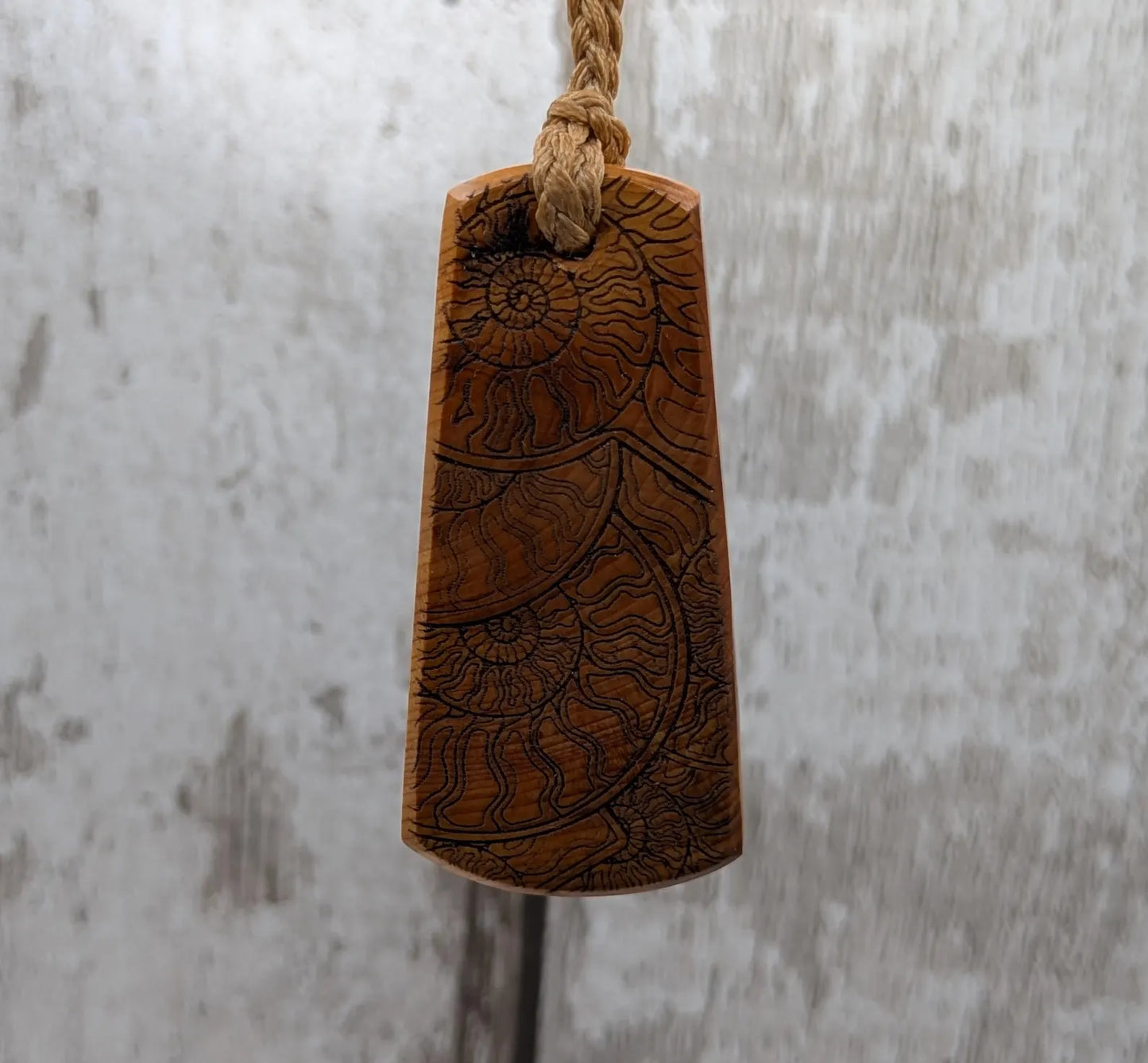 Laser printed all over ammonite on yew wood Pendant.