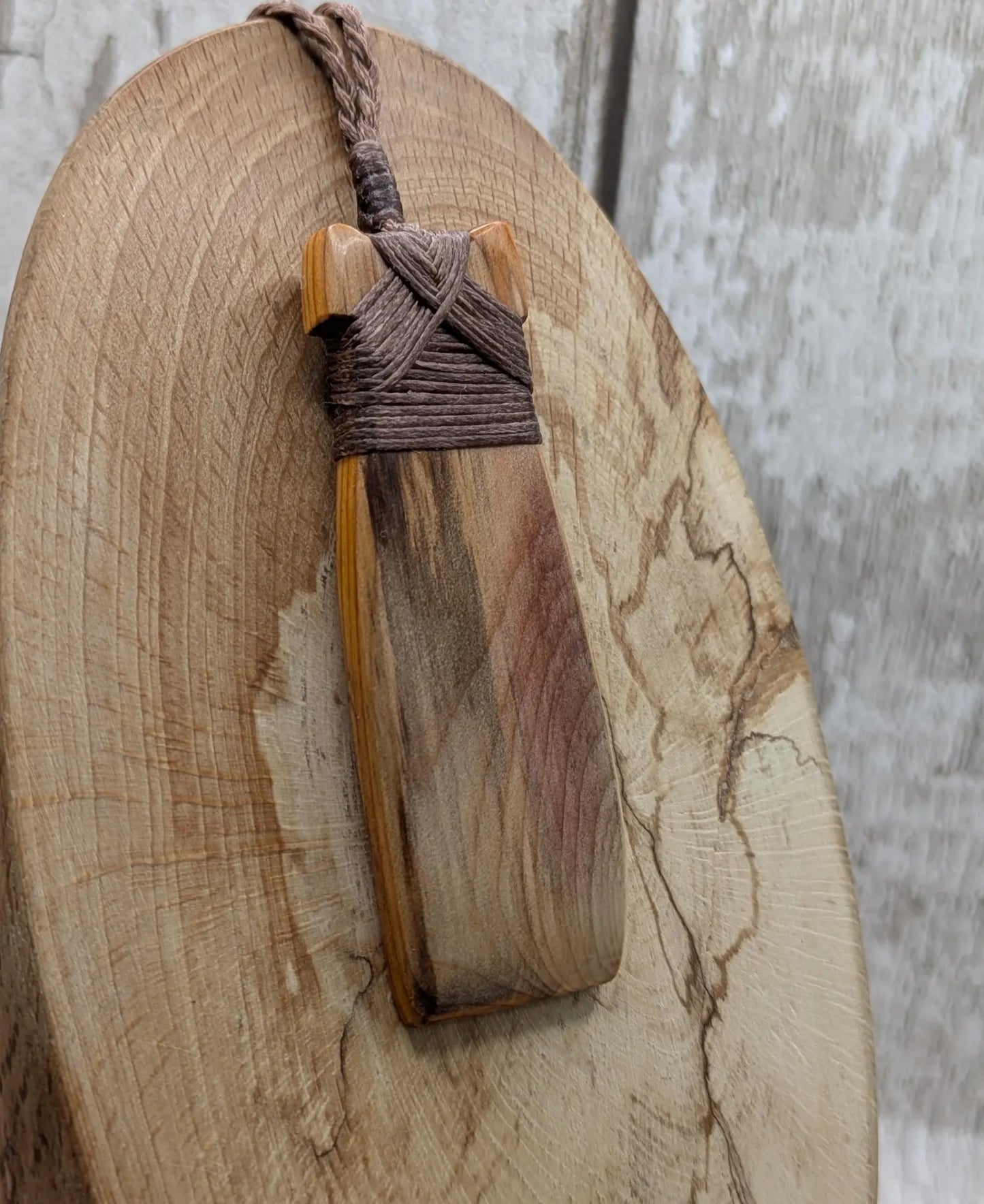 Spalted yew wood Hei Toki adze pendant.