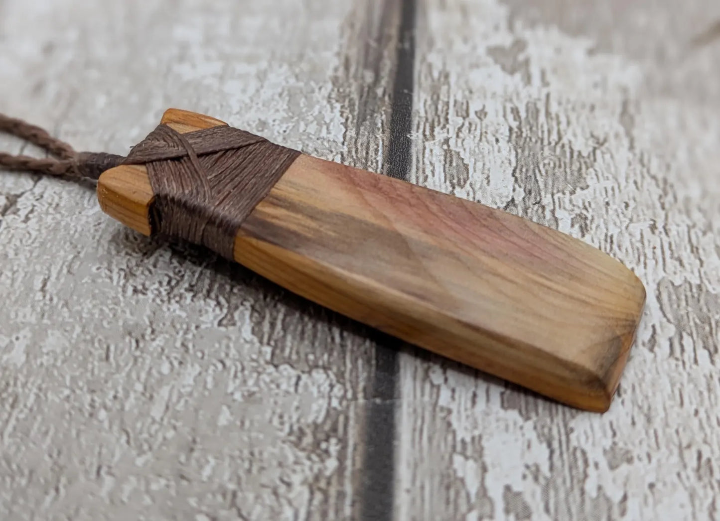 Spalted yew wood Hei Toki adze pendant.