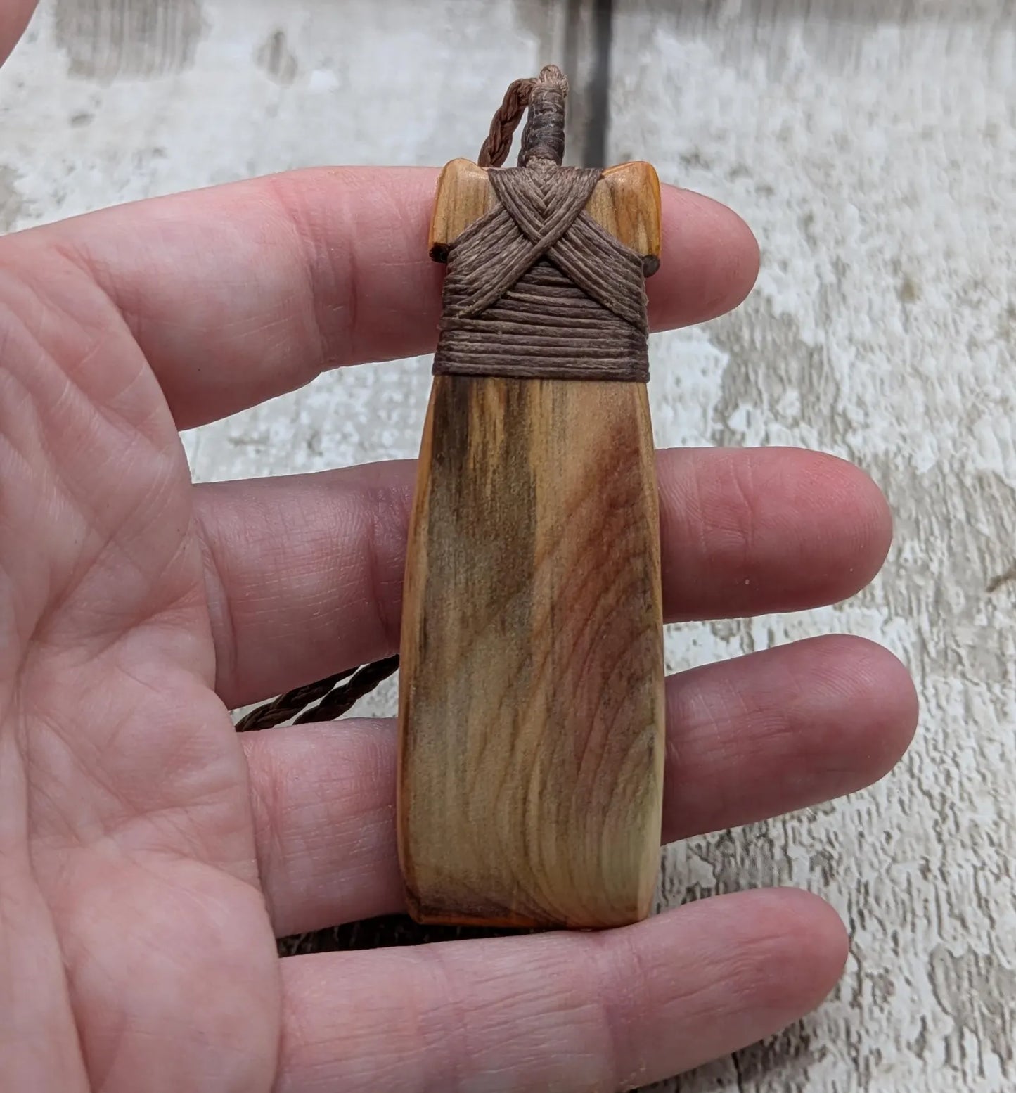 Spalted yew wood Hei Toki adze pendant.