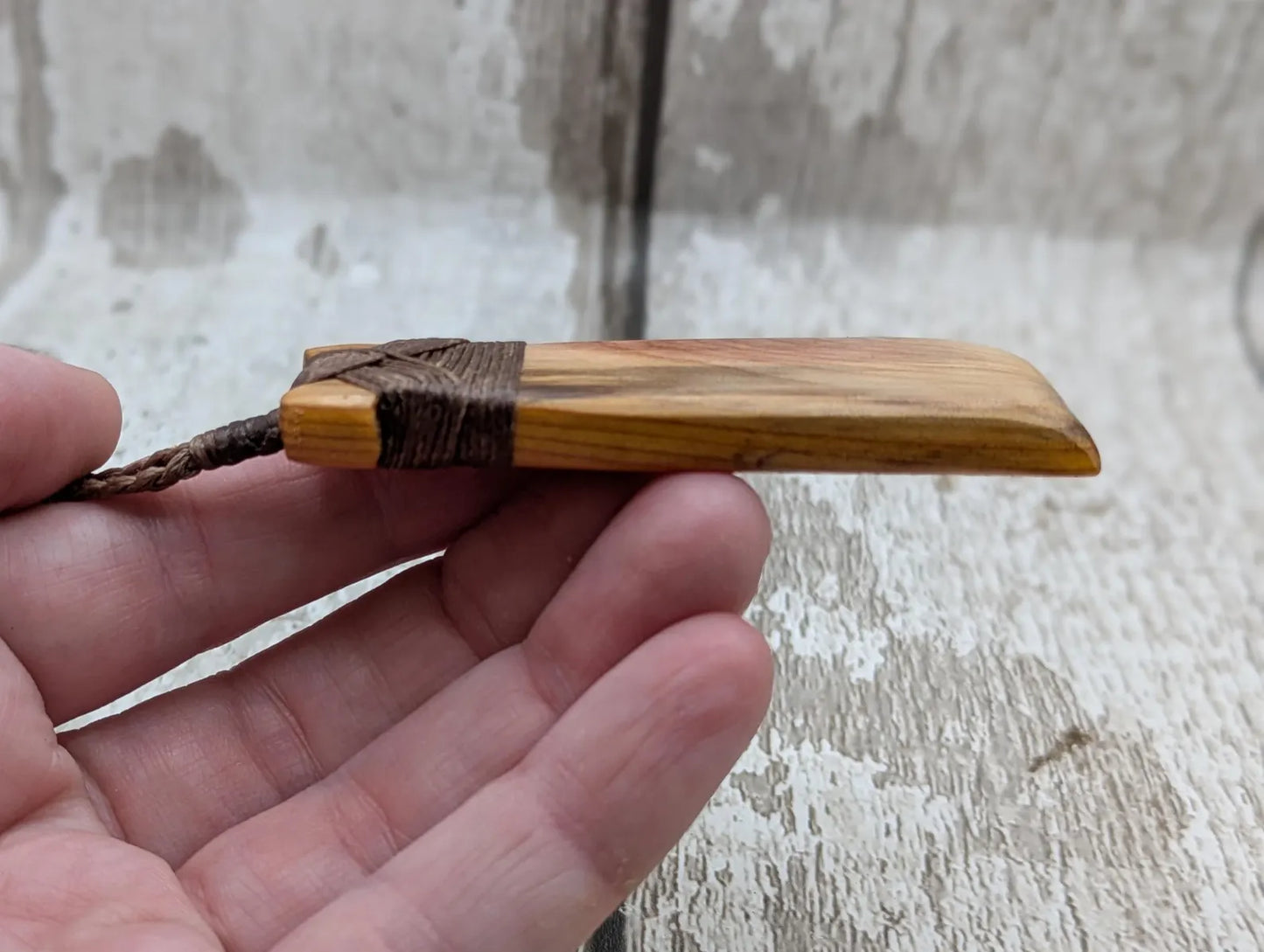Spalted yew wood Hei Toki adze pendant.