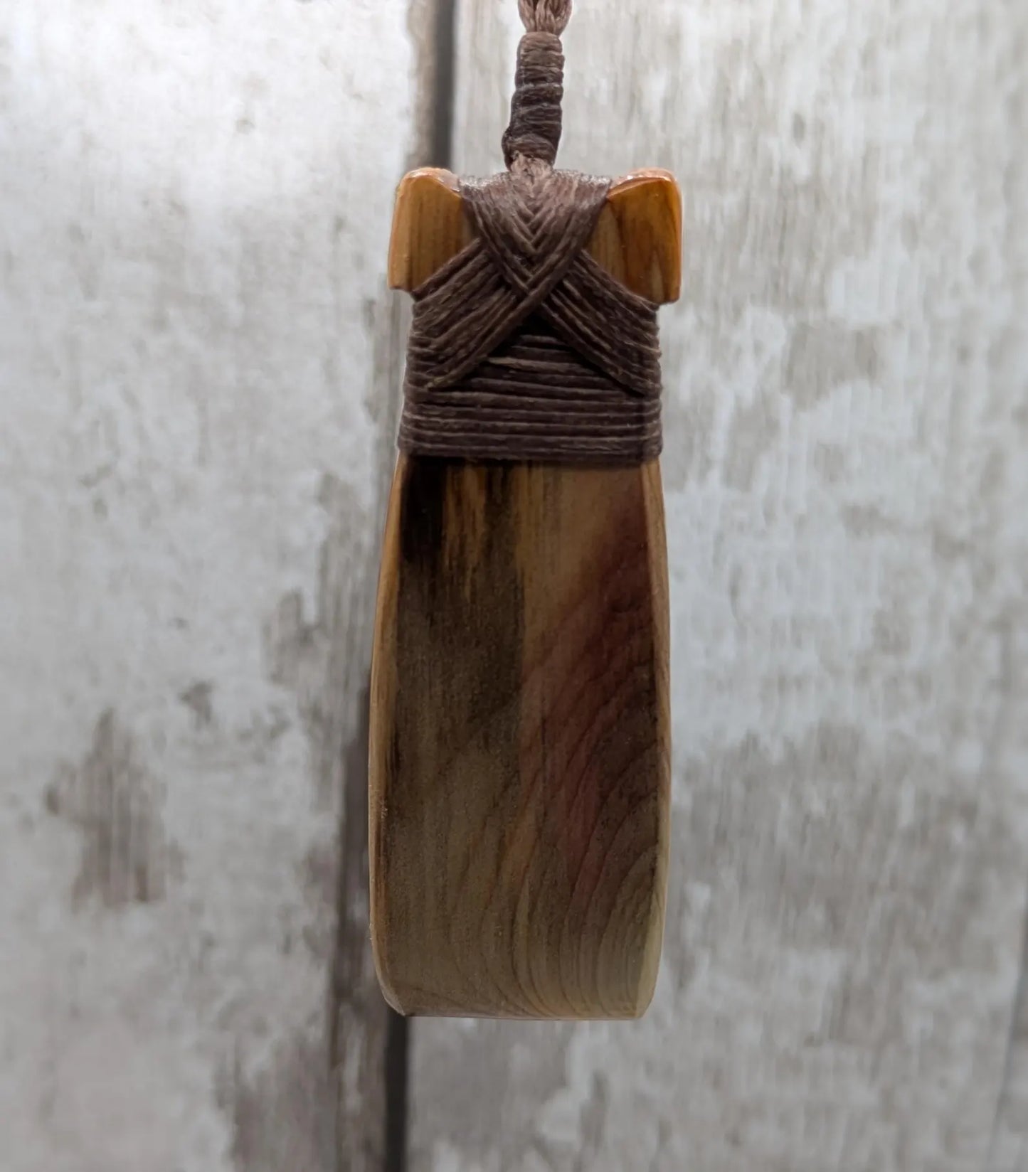 Spalted yew wood Hei Toki adze pendant.