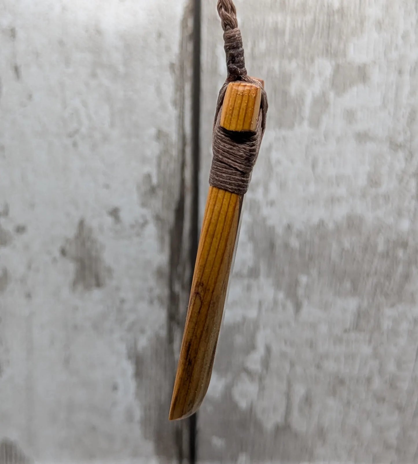Spalted yew wood Hei Toki adze pendant.