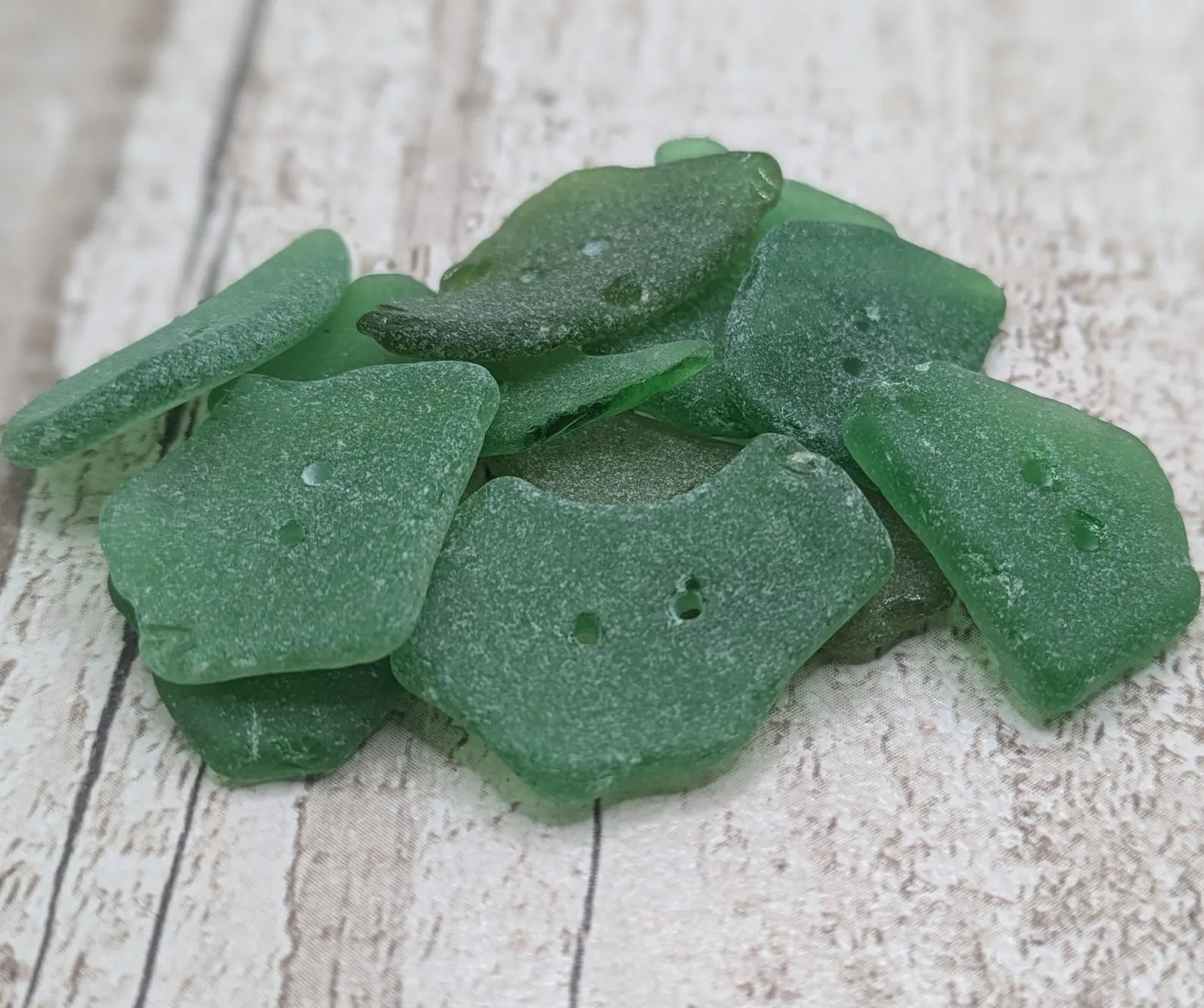 10 green frosted sea glass buttons.