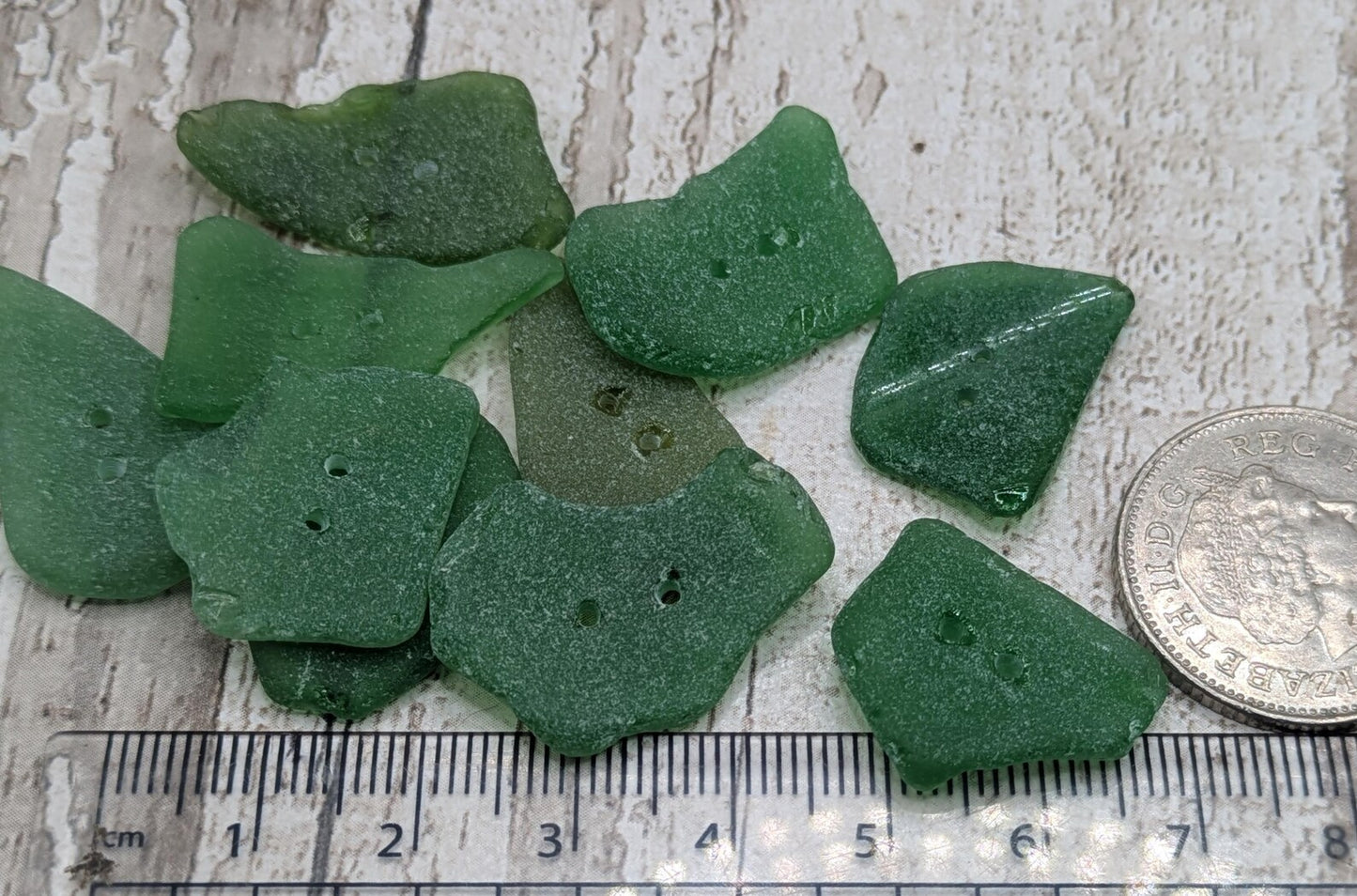 10 green frosted sea glass buttons.