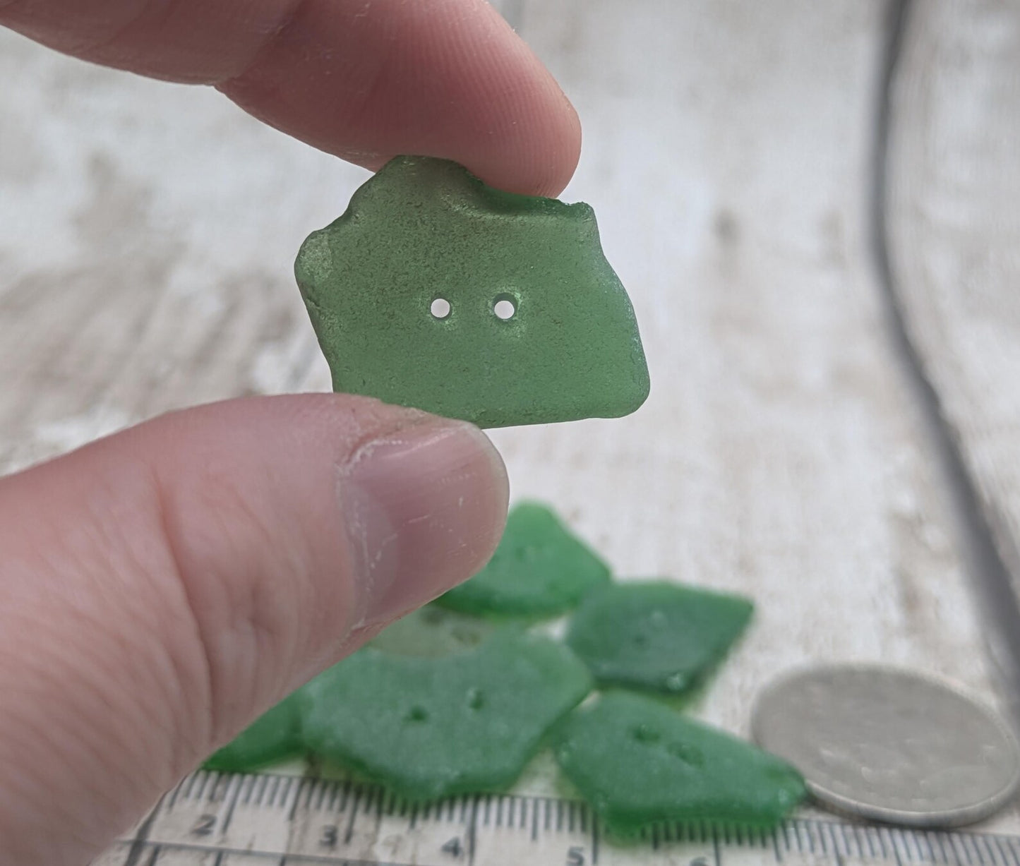 10 green frosted sea glass buttons.