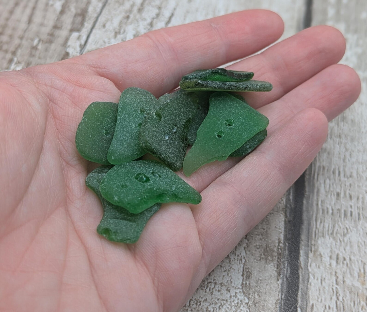 10 green frosted sea glass buttons.