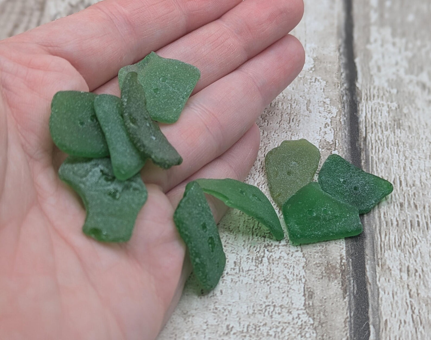 10 green frosted sea glass buttons.