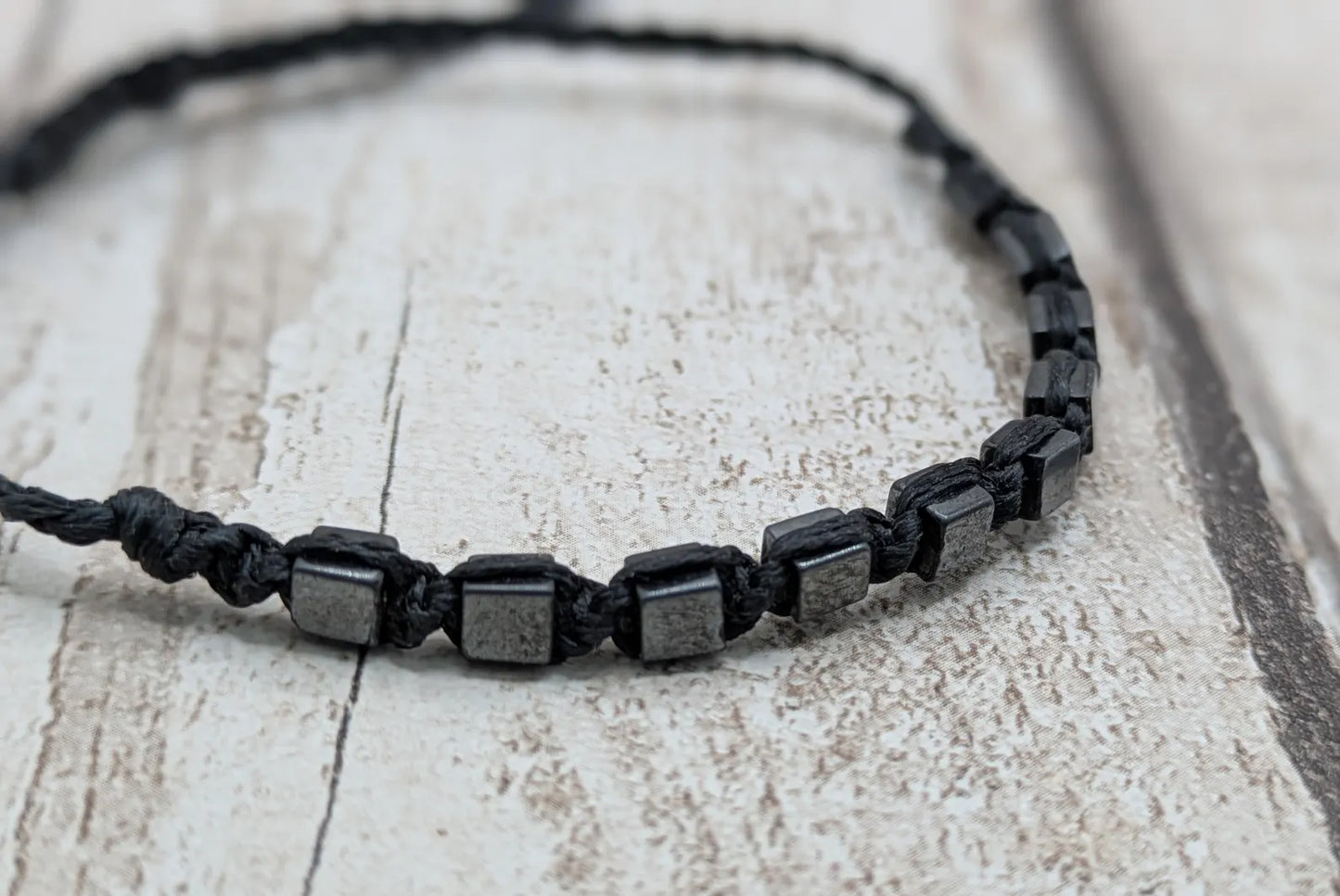 Square hematite beaded macrame bracelet.