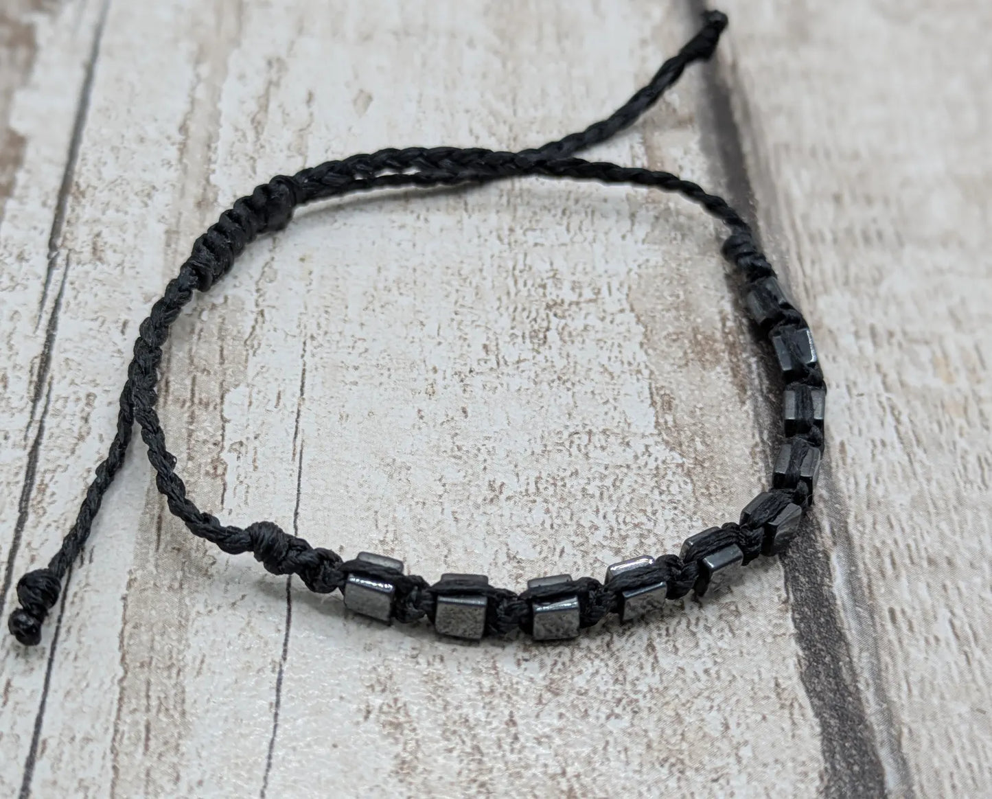 Square hematite beaded macrame bracelet.