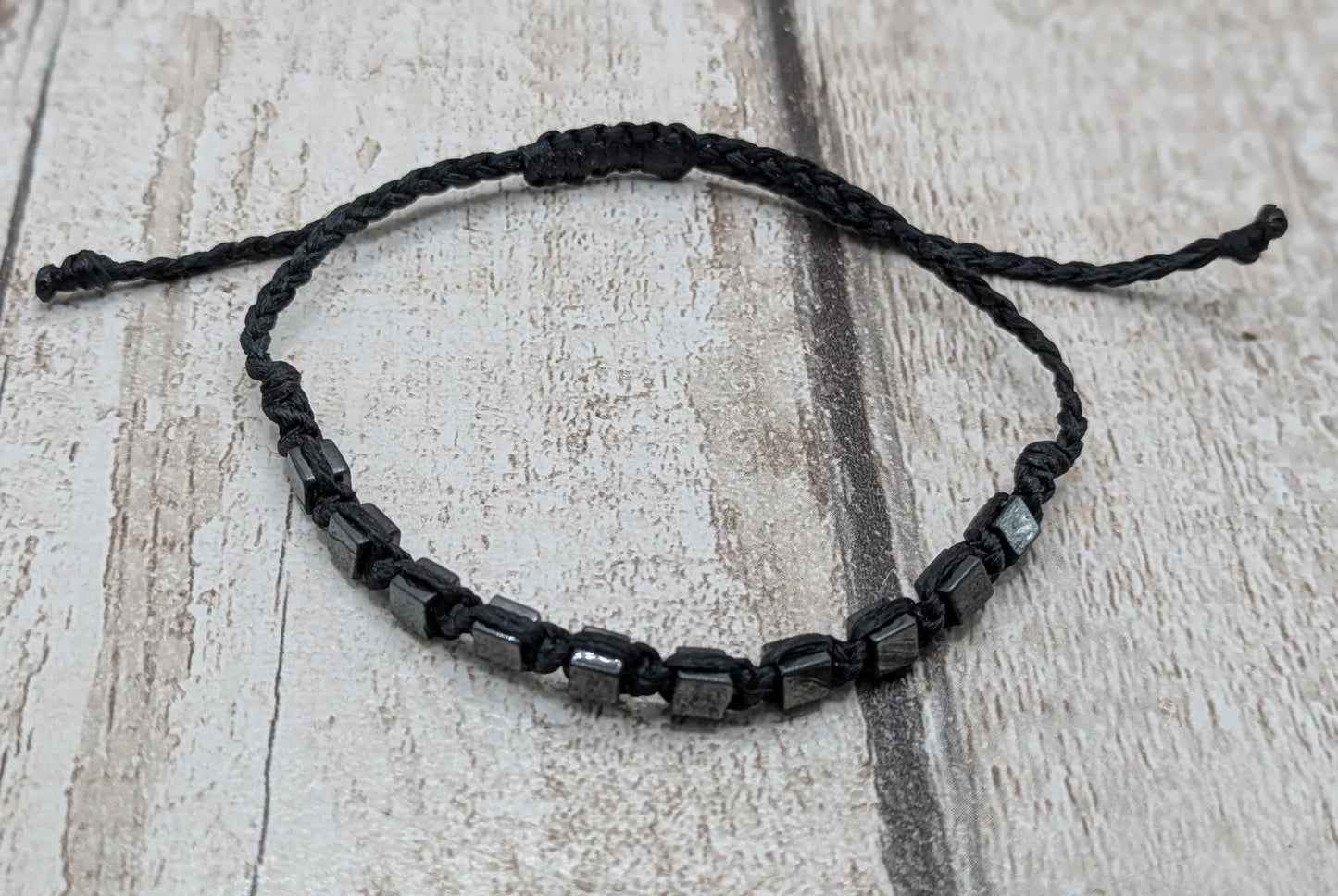 Square hematite beaded macrame bracelet.