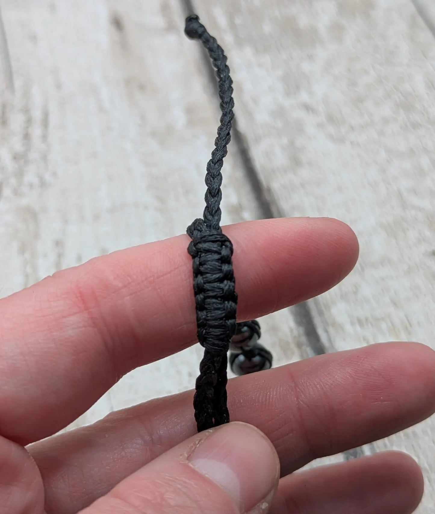 Square hematite beaded macrame bracelet.