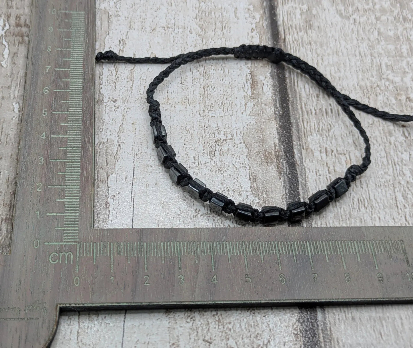 Square hematite beaded macrame bracelet.