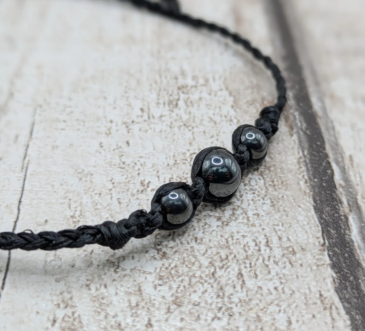 Hematite beaded macrame woven bracelet.
