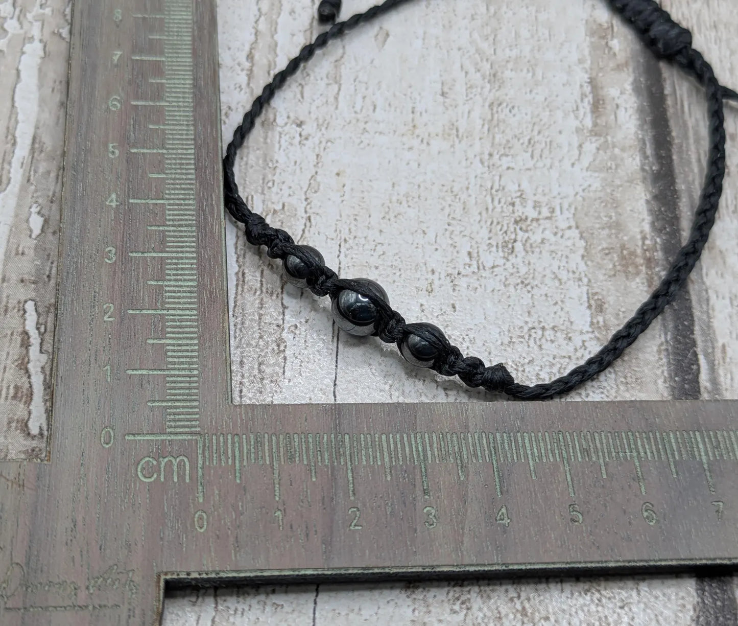 Hematite beaded macrame woven bracelet.