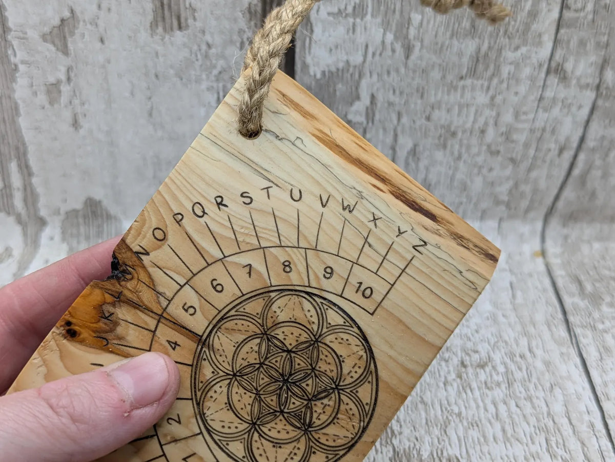 Lace wood mini pocket sized pendulum dowsing board.