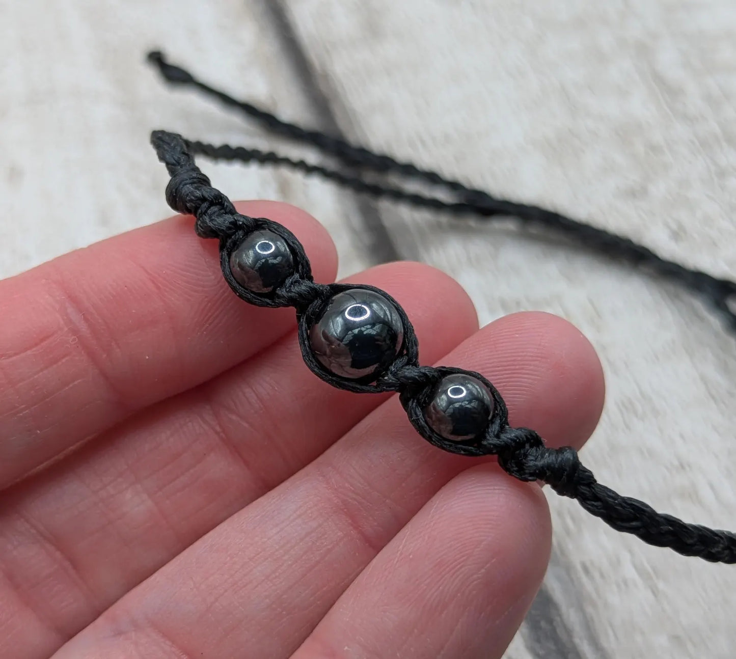 Hematite beaded macrame woven bracelet.