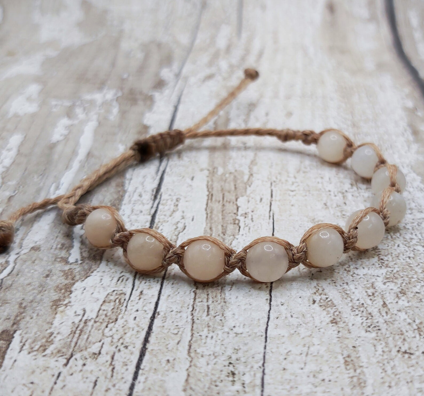 Peach adventurine beaded macrame woven bracelet.