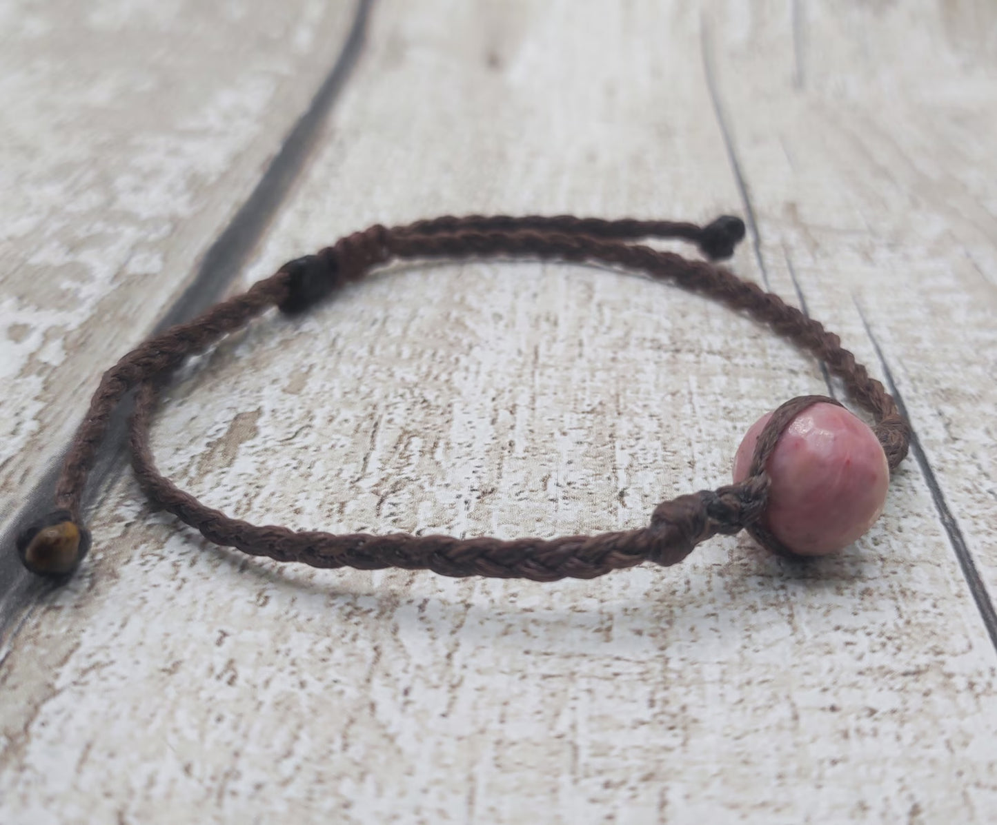 Rhodochrosite macrame woven adjustable bracelet.