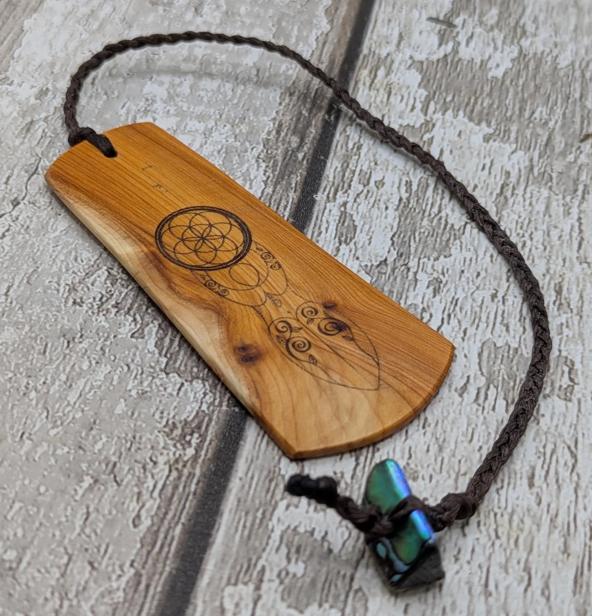 Yew wood, goddess print bookmark with pāua abalone bead tassel.