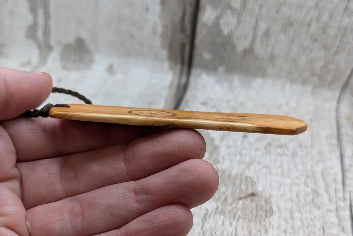 Yew wood, goddess print bookmark with pāua abalone bead tassel.